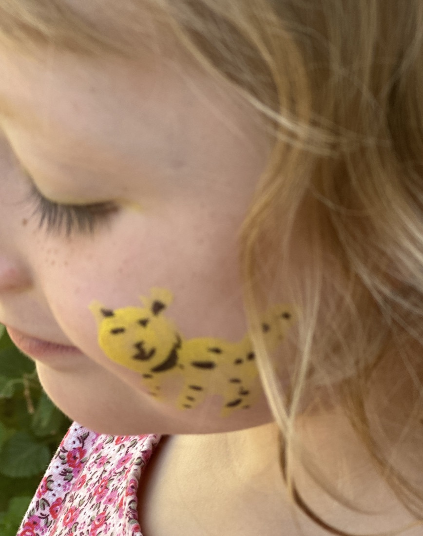 Leopard cheek face paint design